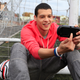 Illustration for article titled Attractive Young Men Smiling at the PlayStation Vita